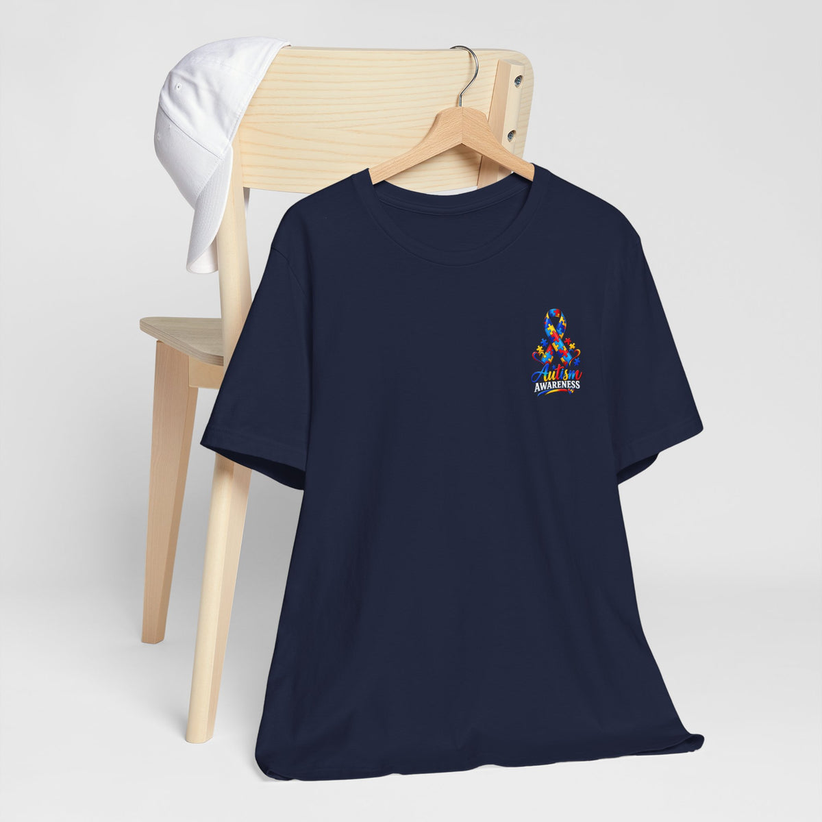 Autism Awareness Ribbon Chest Tee — 'Different, Not Less' Short Sleeve T-Shirt