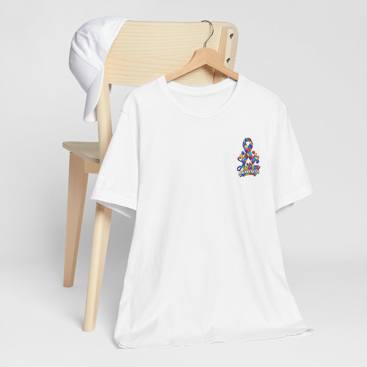 Autism Awareness Ribbon Chest Tee — 'Different, Not Less' Short Sleeve T-Shirt