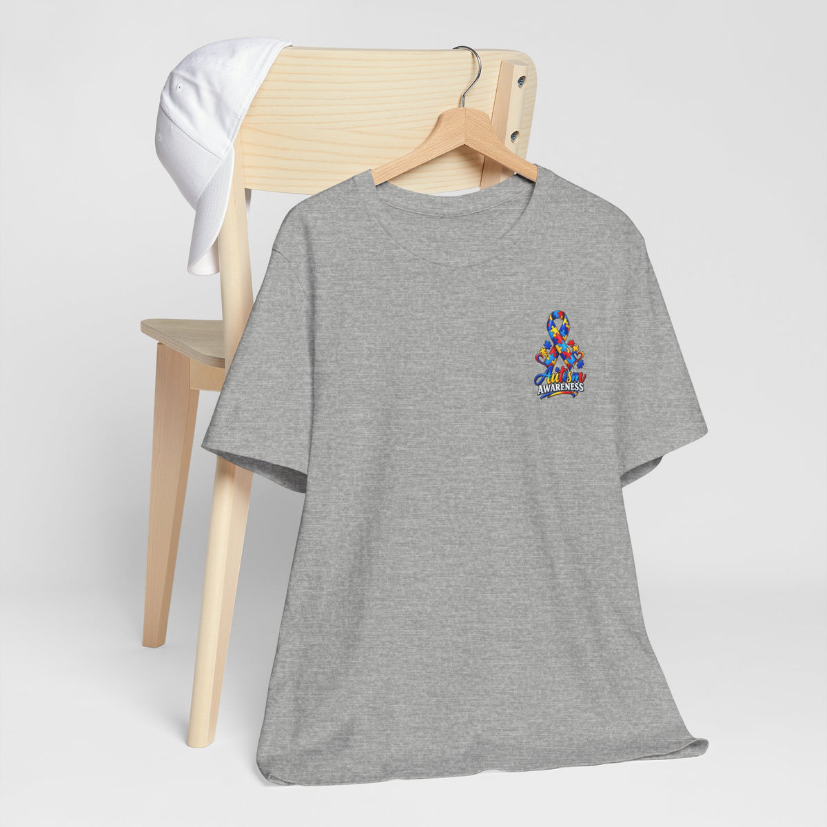 Autism Awareness Ribbon Chest Tee — 'Different, Not Less' Short Sleeve T-Shirt